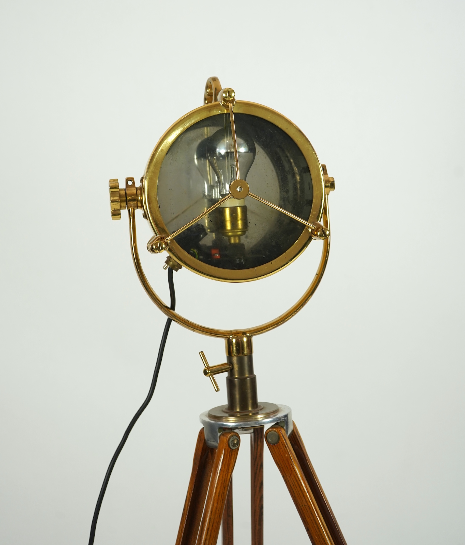 A mid 20th century polished brass marine searchlight